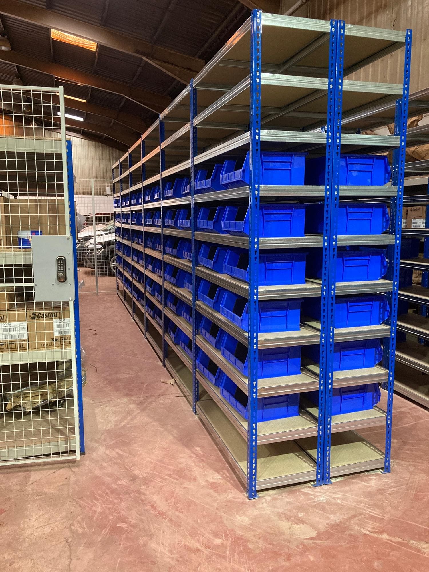 Empty shelves with plastic boxes