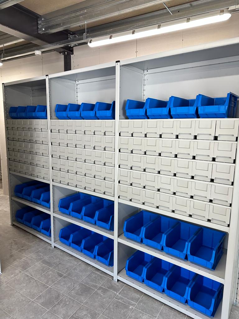 Shelves with plastic boxes